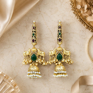 Close-up ear view showing the Kundan-style setting and pearl jhumka drops