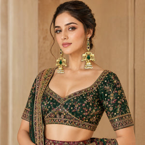 Close-up of Kundan-style stones, pearl-style drops and gold-tone jhumka detailing