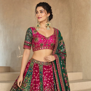 Gold-tone Kundan pearl jhumka statement earrings worn by a model