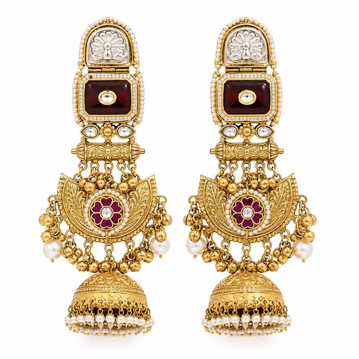 Maroon-stone chandbali earrings styled in an elegant jewellery flat lay