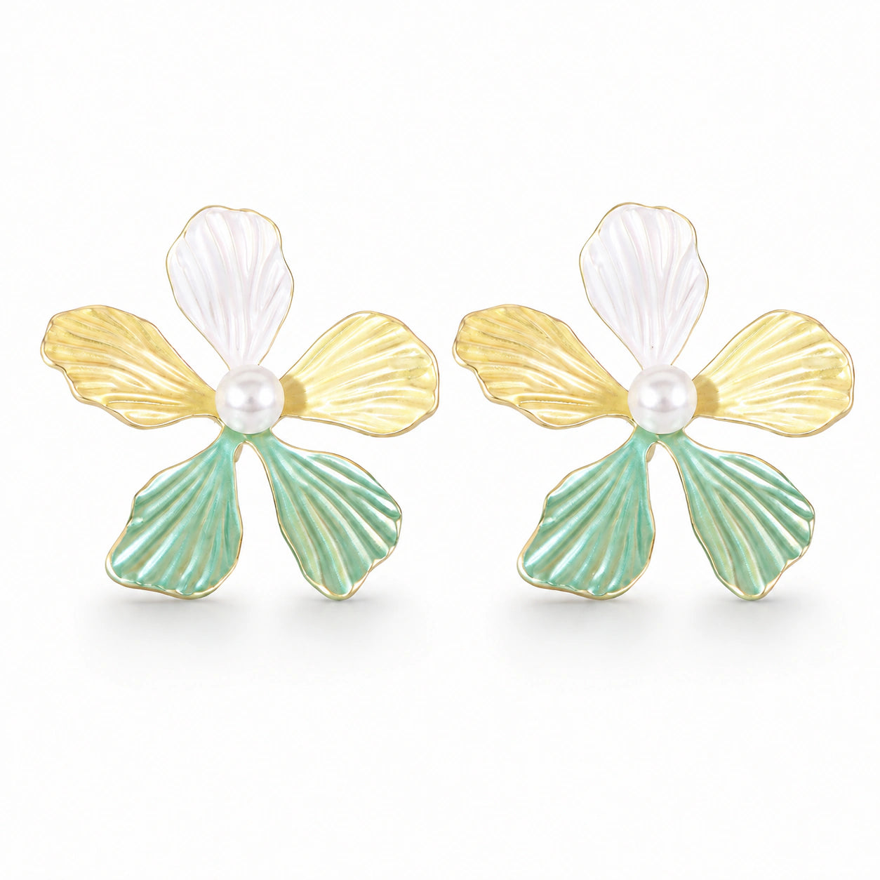 Multicolour floral pearl earrings styled in a modern jewellery flat lay