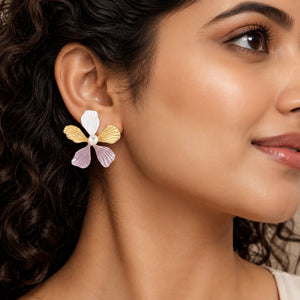 Lavender floral pearl earrings styled in a modern jewellery flat lay