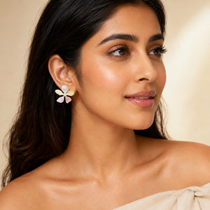 Angled view of multicolour pink floral pearl-style earrings