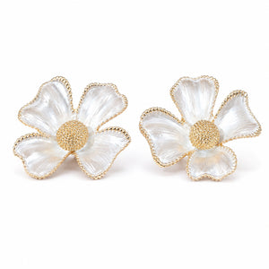 Close-up of sculpted gold flowers and pearl-style drops