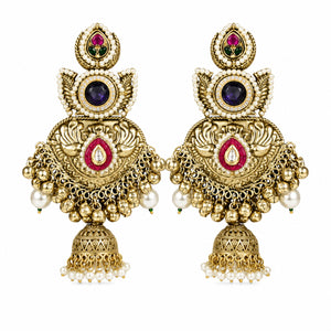 Angled view of gold-tone Kundan-style jhumka earrings with layered pearl details