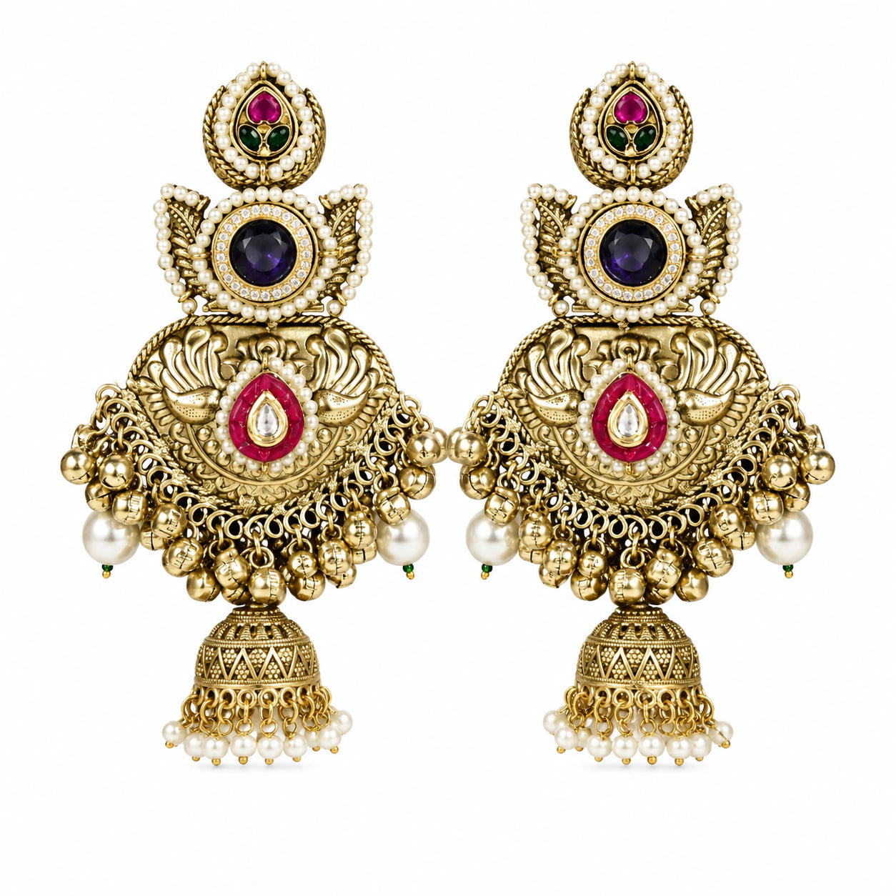 Angled view of gold-tone Kundan-style jhumka earrings with layered pearl details