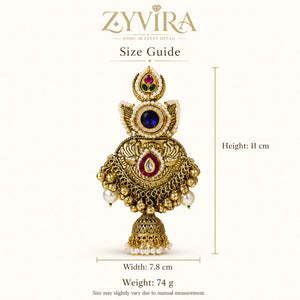 Gold-tone Kundan-style pearl statement jhumka earrings worn by a model