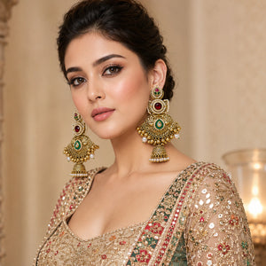 Pearl Kundan-style statement jhumka earrings styled in an elegant jewellery flat lay