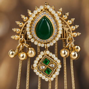 Angled view of gold-tone statement earrings with layered pearl-style tassels