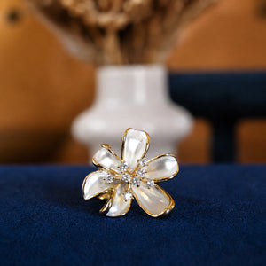 Alternate detail view of the pearl-white floral ring