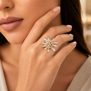 Angled view of the pearl-white crystal starburst ring