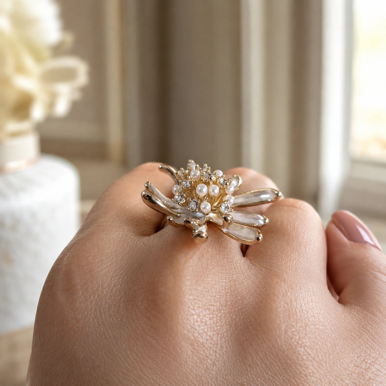 Top view of the pearl-white floral starburst ring