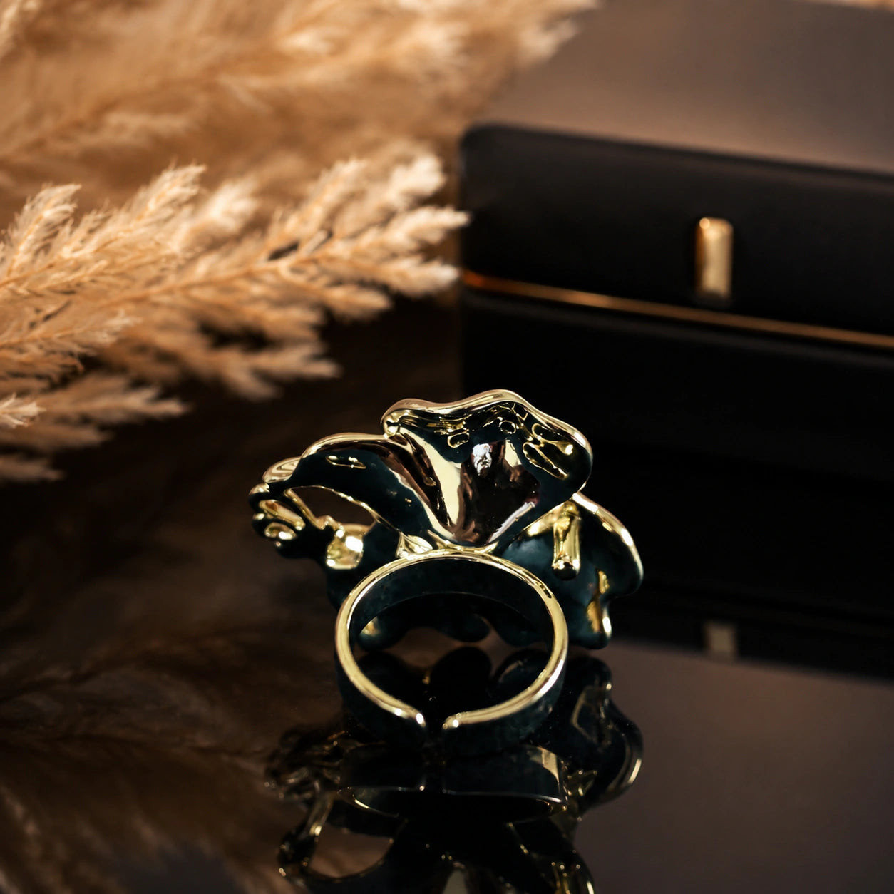 Pearl-white butterfly ring styled in an elegant jewellery flat lay