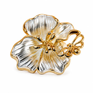 Close-up of ribbed floral petals and butterfly detailing