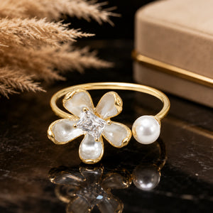 Angled view of the pearl-white floral crystal open ring