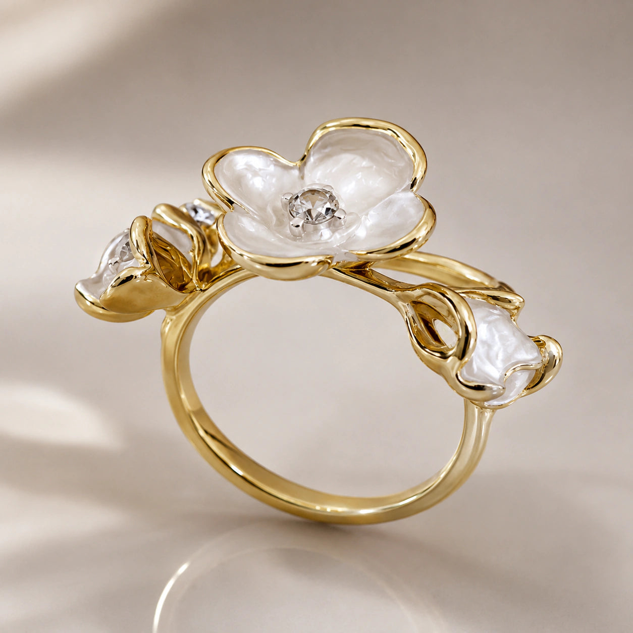 Angled view of the pearl-white floral crystal ring