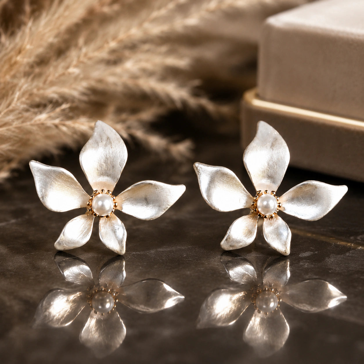 Close-up of pearl-white floral petals and gold-tone edging