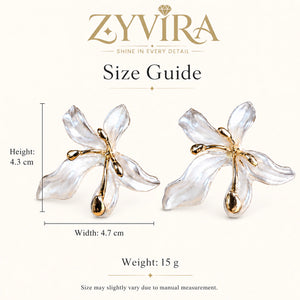 Close-up of pearl-white leaf petals and gold-tone floral detailing