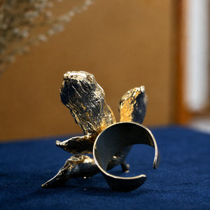 Close-up of pearl-white leaf vine ring detailing