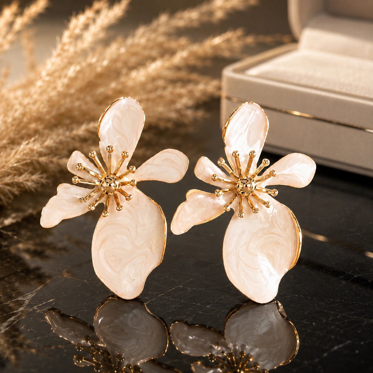 Close-up of pearl-white marbled floral petals and gold-tone drop detailing