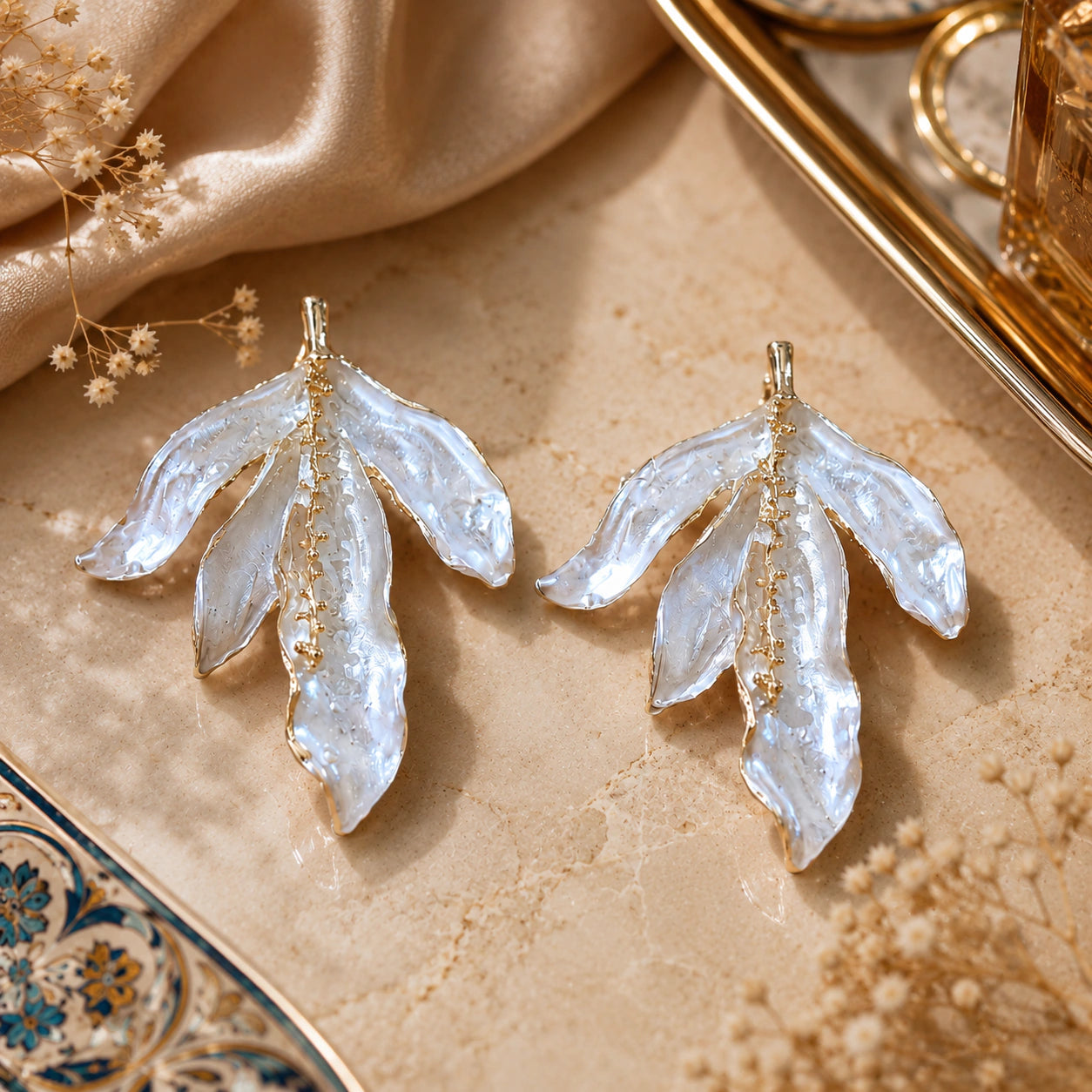 Alternate product view of pearl-white sculptural leaf earrings