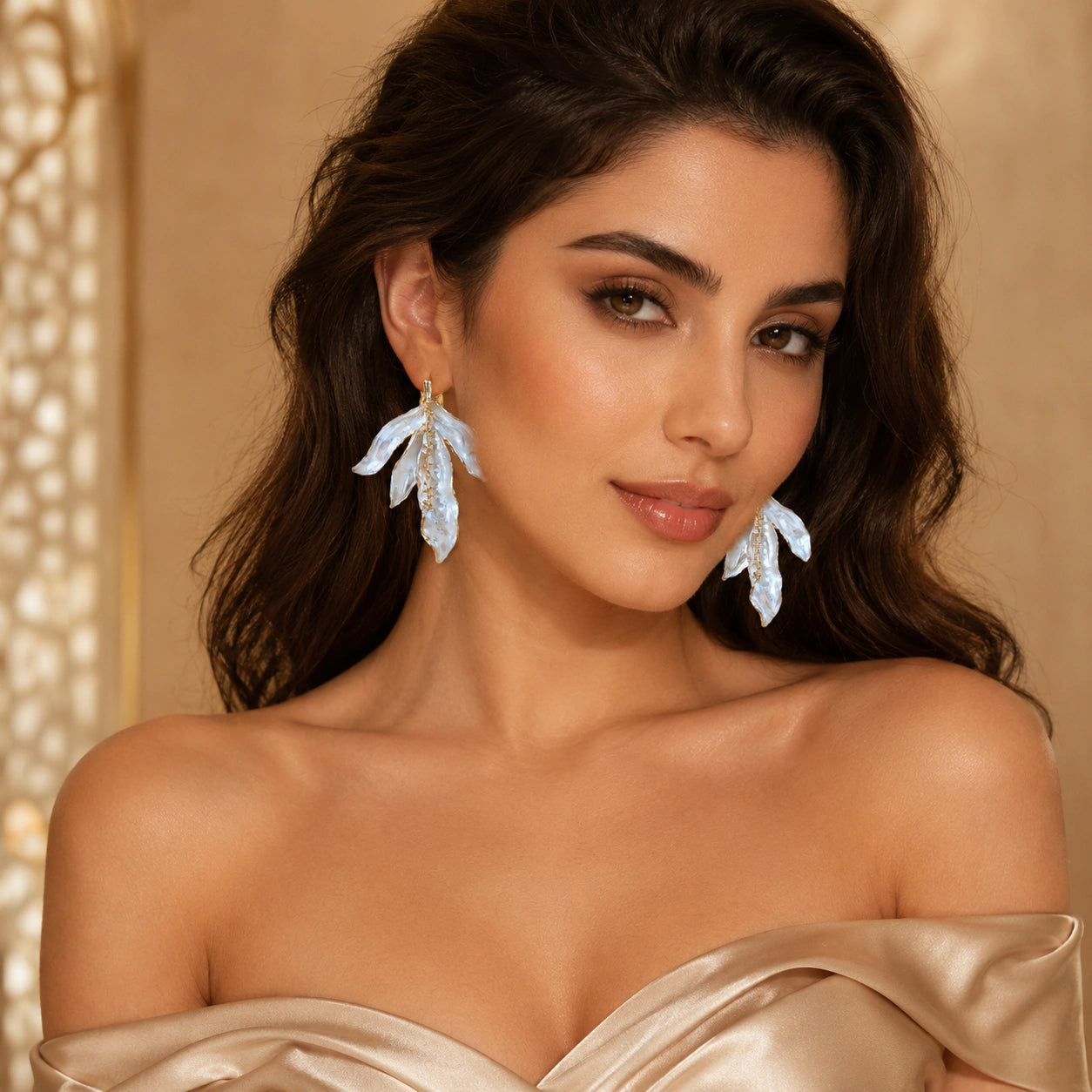 Pearl-white sculptural leaf gold-tone dangle earrings