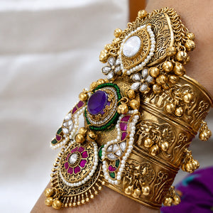 Angled view of the purple Kundan pearl handwork kada