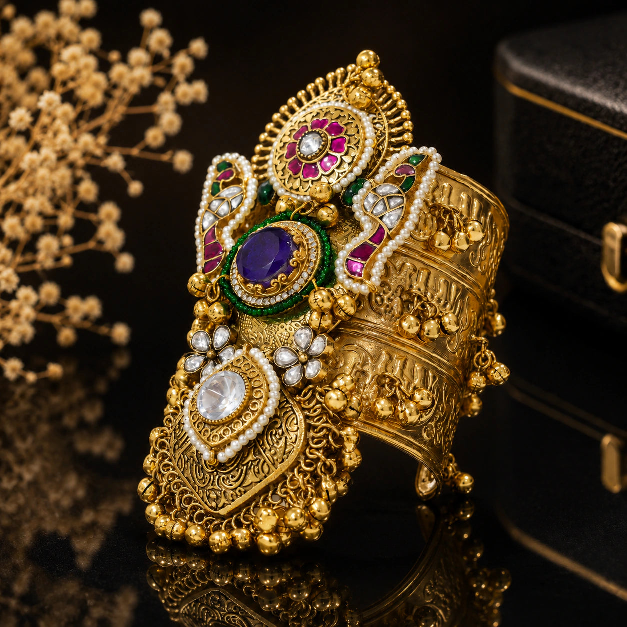 Close-up of purple Kundan stones, pearls and handwork detailing