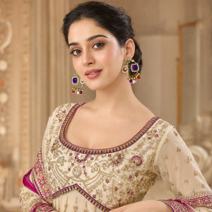 Angled view of gold-tone purple pearl chandbali earrings
