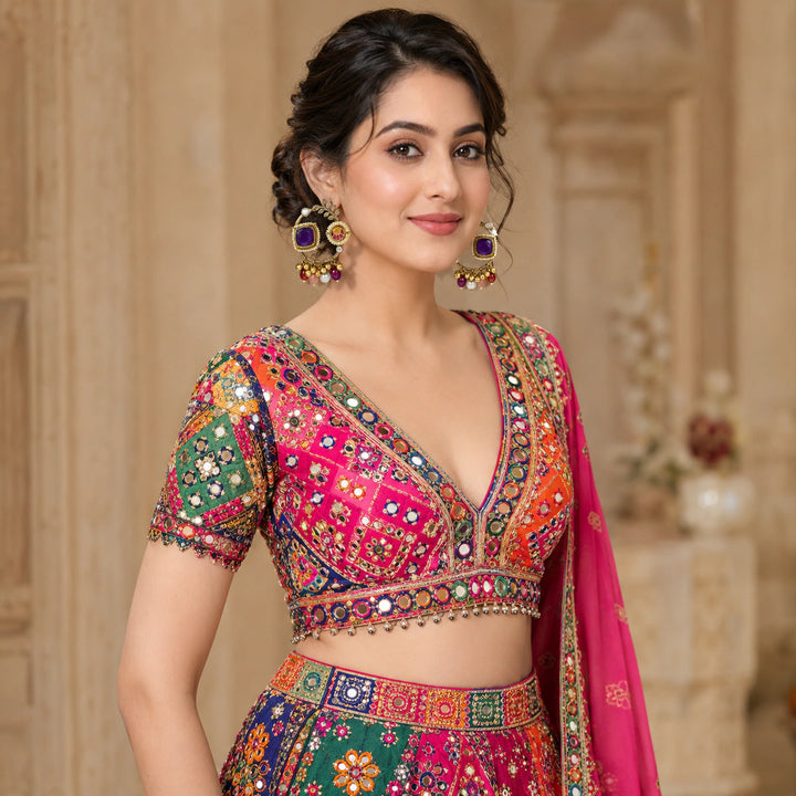 Close-up of purple accents, pearl-style borders and gold-tone chandbali detailing