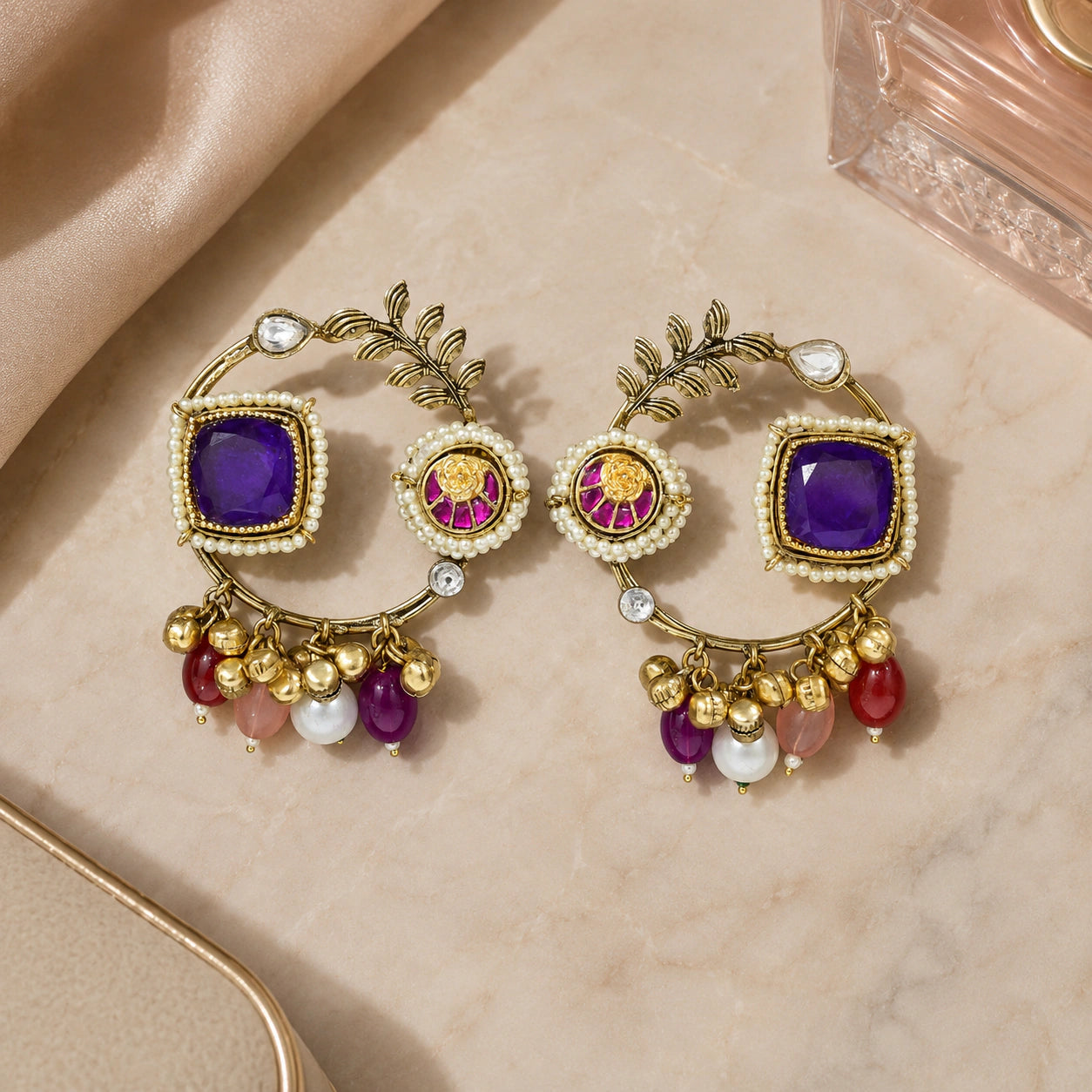 Product details card for gold-tone purple pearl chandbali earrings