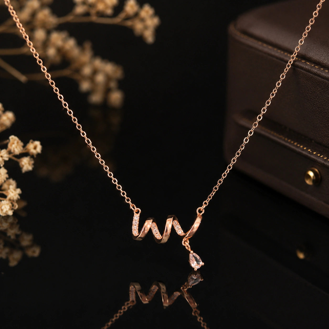 Close-up of the crystal wave and drop pendant detailing
