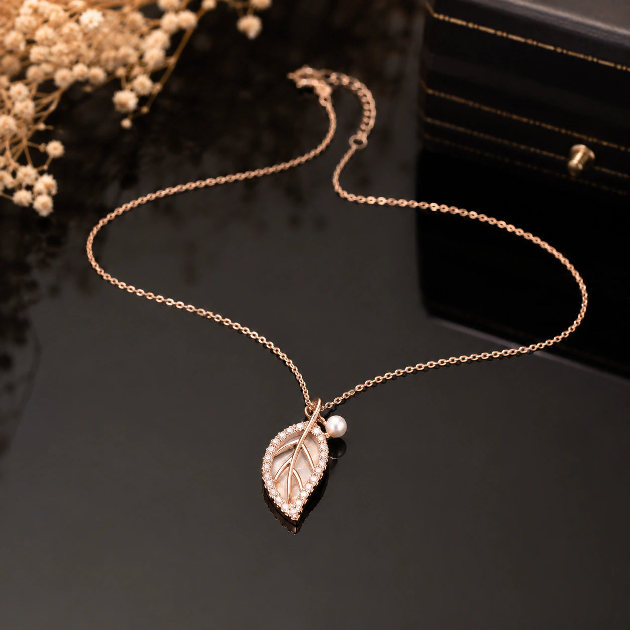 Alternate product view of the rose-gold pearl leaf necklace