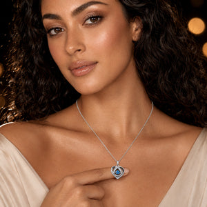 Angled view of the silver blue crystal heart necklace