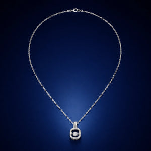 Silver crystal halo necklace styled in an elegant jewellery flat lay