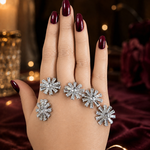 Silver crystal starburst handcuff bracelet on a dark jewellery studio display