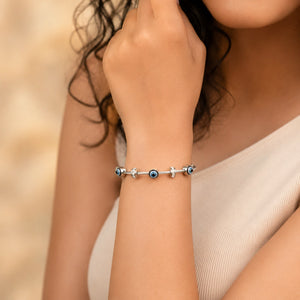Close-up of the evil-eye charm and twisted cable detailing