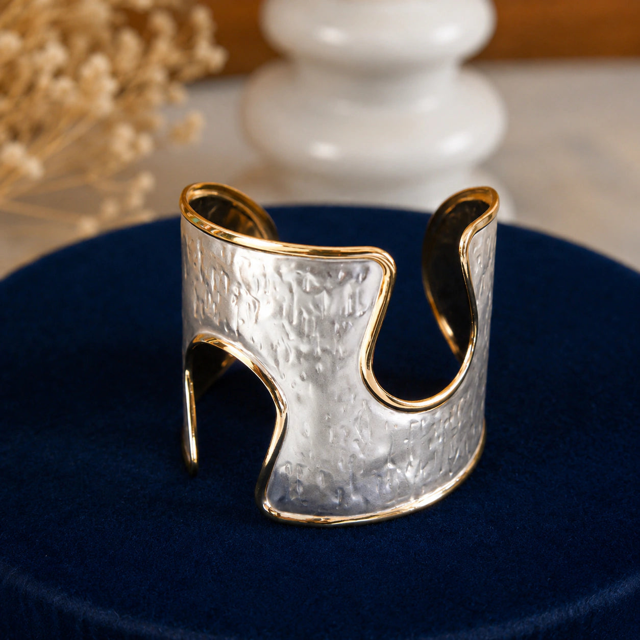 Side view of the silver-and-gold hammered wave kada