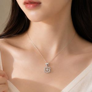 Alternate detail view of the interwoven heart crystal pendant