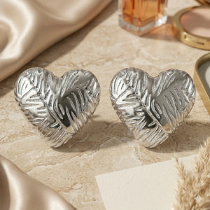 Close-up of botanical leaf relief and heart-shaped detailing