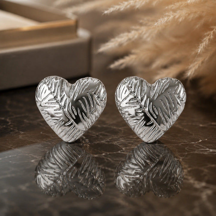 Silver botanical leaf relief heart stud earrings