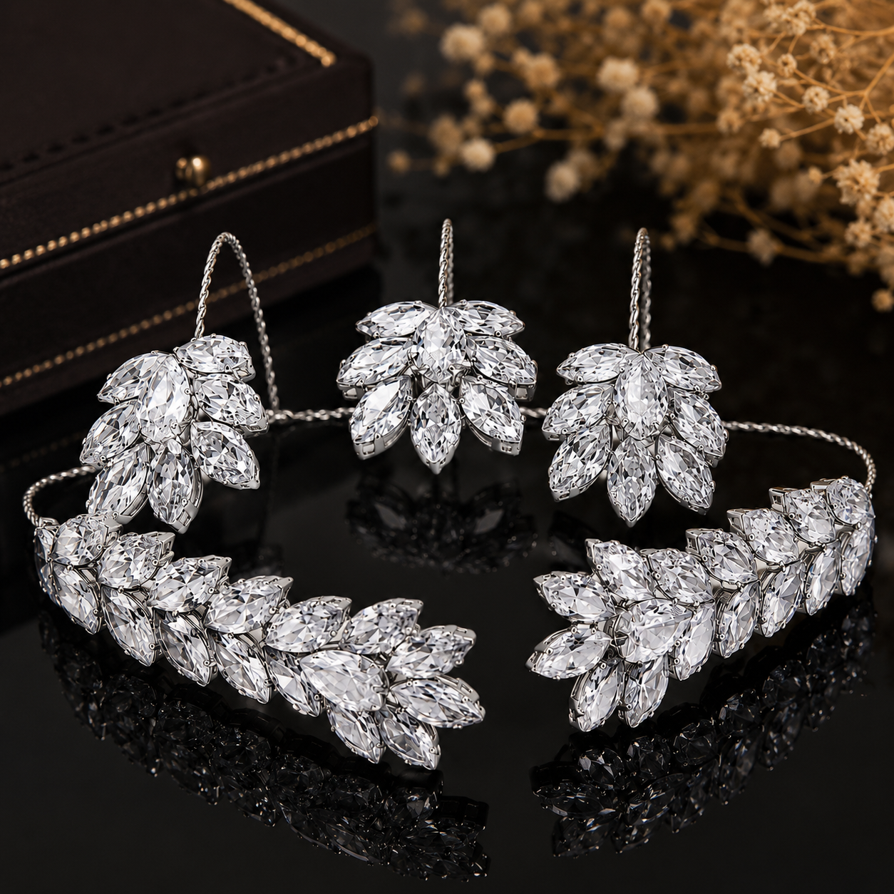 Silver marquise-leaf handcuff bracelet on a dark jewellery studio display