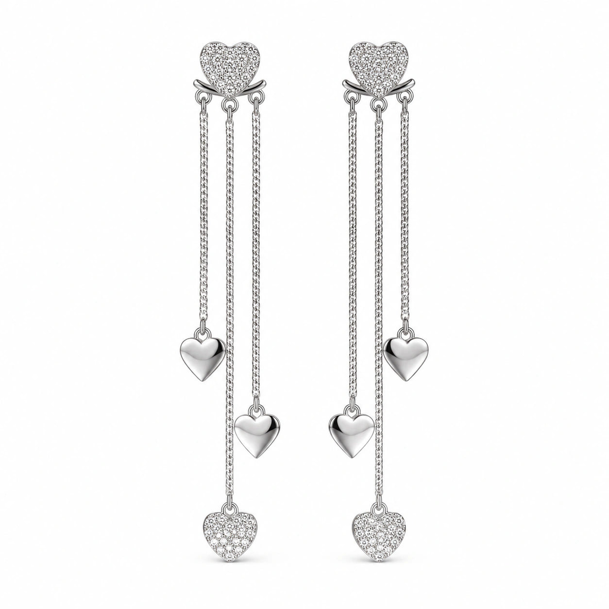 Angled view of silver pavé heart triple-chain earrings