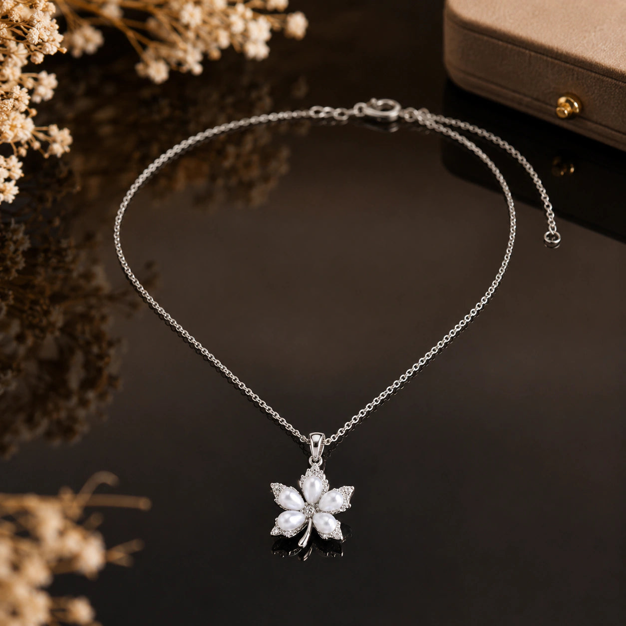 Alternate detail view of the silver pearl floral pendant