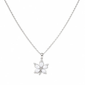 Silver pearl floral necklace styled in an elegant jewellery flat lay