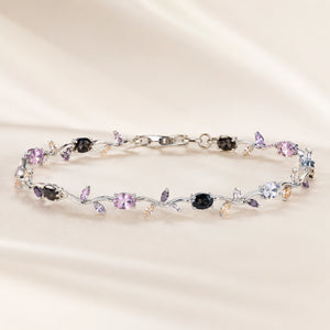 Silver tulip bracelet styled in an elegant jewellery flat lay