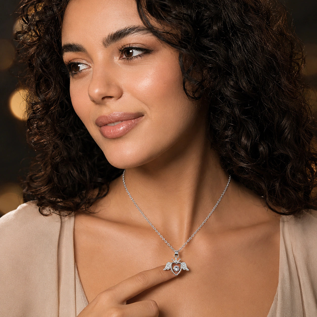 Angled view of the silver winged heart pendant necklace