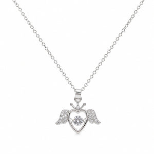 Close-up of the silver winged heart pendant detailing