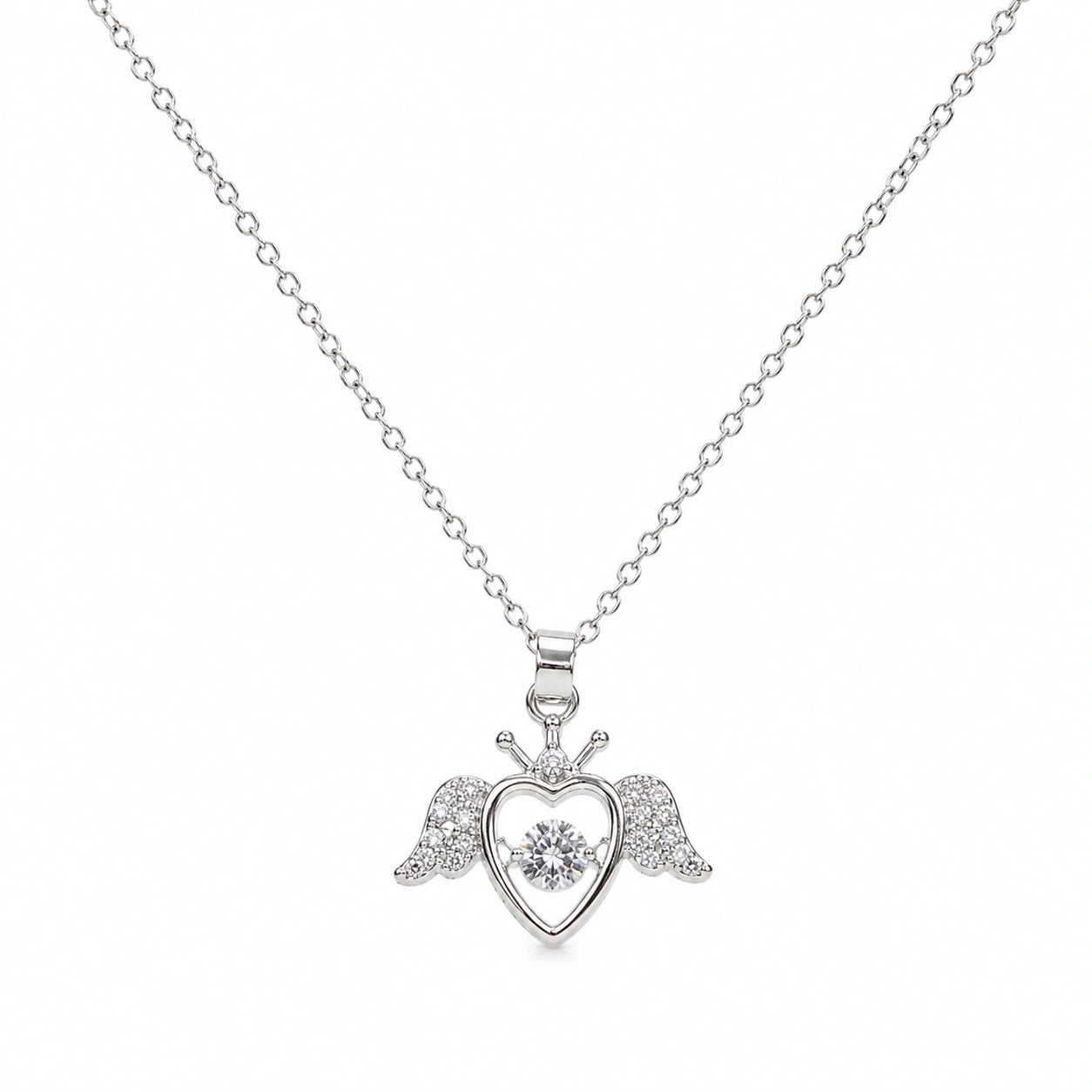 Close-up of the silver winged heart pendant detailing