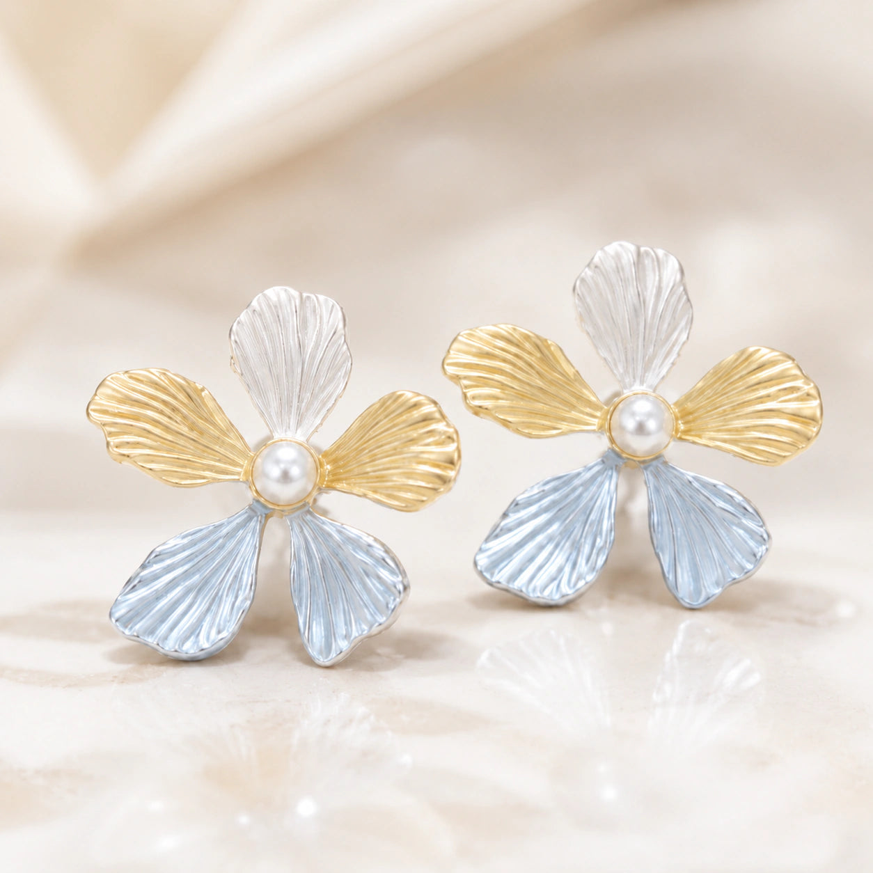 Close-up of sky blue flowers and pearl-style drops